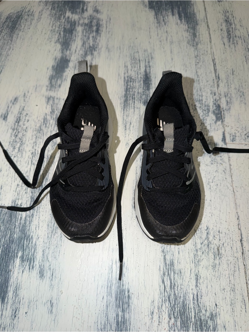 New Balance Kids Black Athletic Sneakers with Gray Pull Tabs